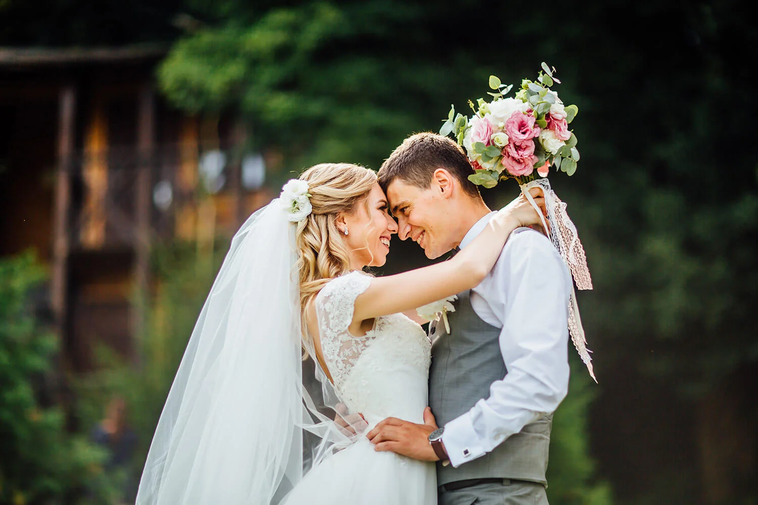 a man and woman in wedding attire hugging